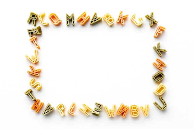 Free Photo uncooked alphabet pasta frame