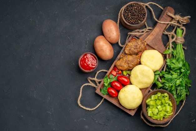 Free Photo uncooked vegetables on a brown cutting board