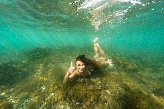 Underwater shot of woman diving