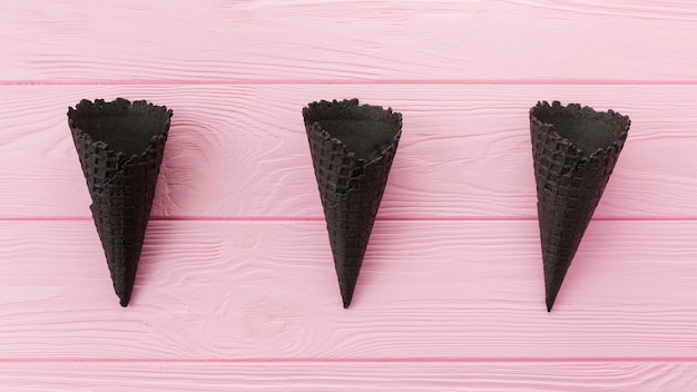 Free Photo unfilled charcoal waffle cones 