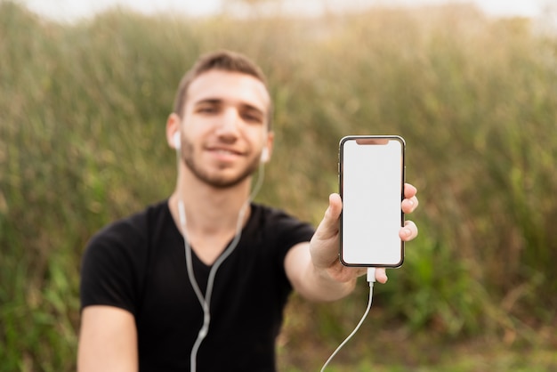 University student showing his phone