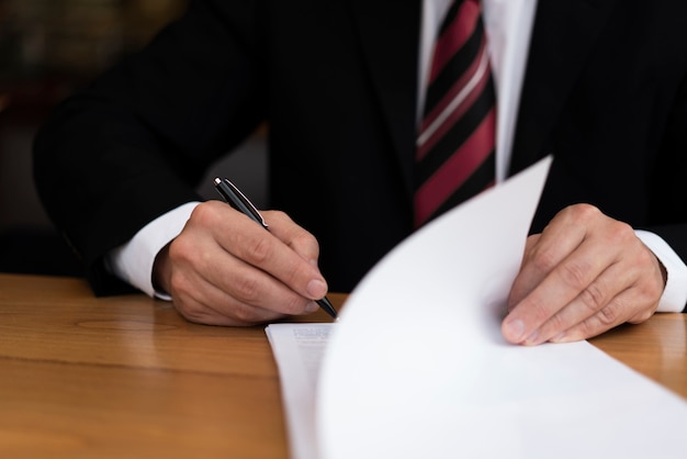 Free photo unrecognisable business man writing front view