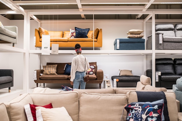 Free Photo unrecognizable black female customer choosing furniture in shopping center