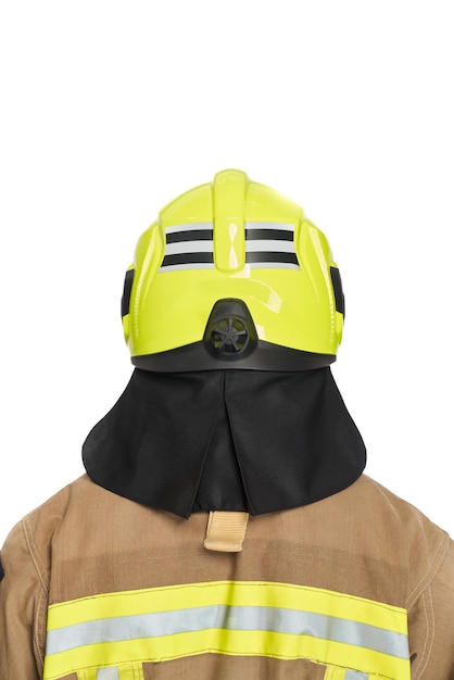 Unrecognizable firefighter in yellow protective helmet and uniform in studio back view of anonymous