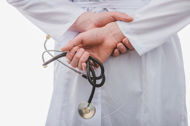 Unrecognizable man holding stethoscope