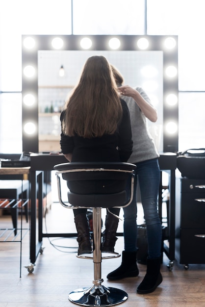 Free photo unrecognizable stylist with client