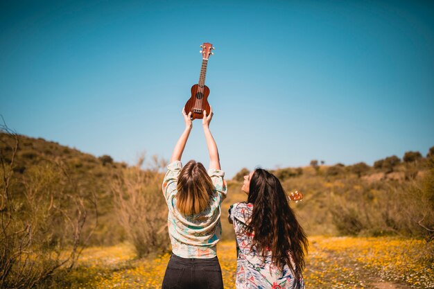 Unrecognizable women with ukulele