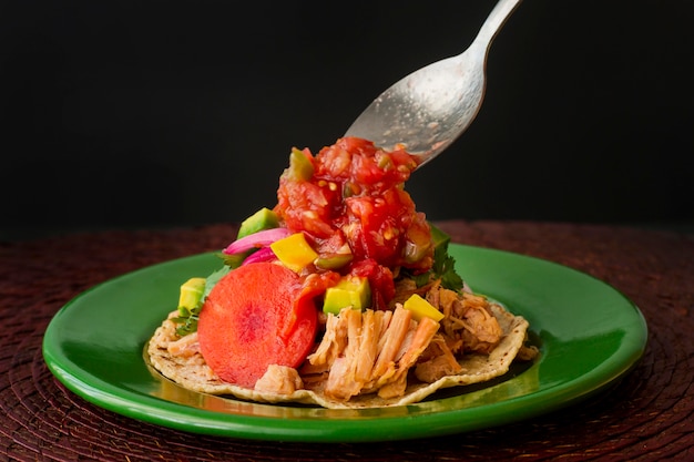 Free Photo unwrapped tortilla on green plate