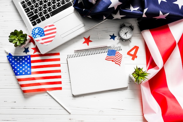 Usa independence day concept with notepad and laptop