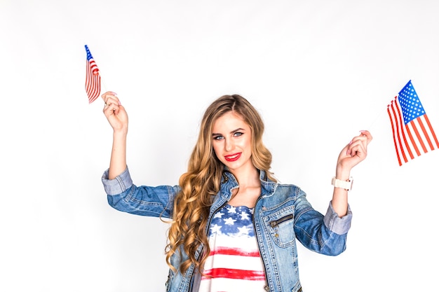 Free photo usa independence day concept with woman holding flags