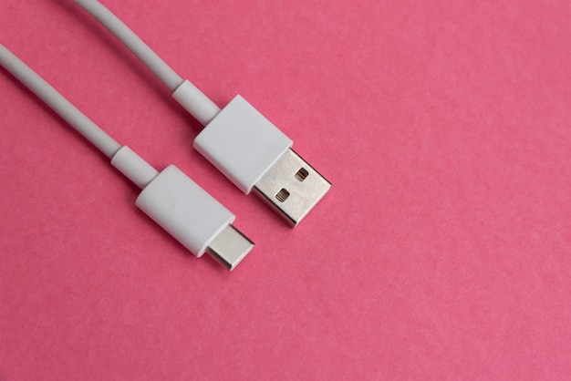 USB cable type C over pink background