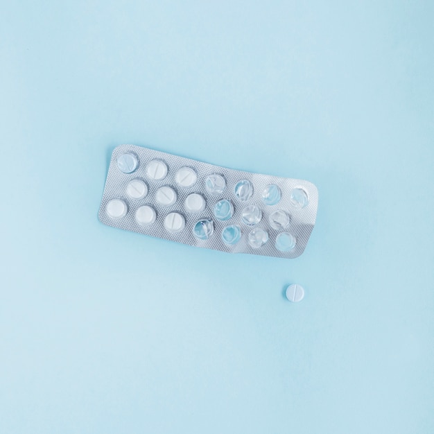 Free Photo used blister pack with pills on blue background