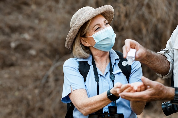 Free photo using hand sanitizer while traveling in the new normal