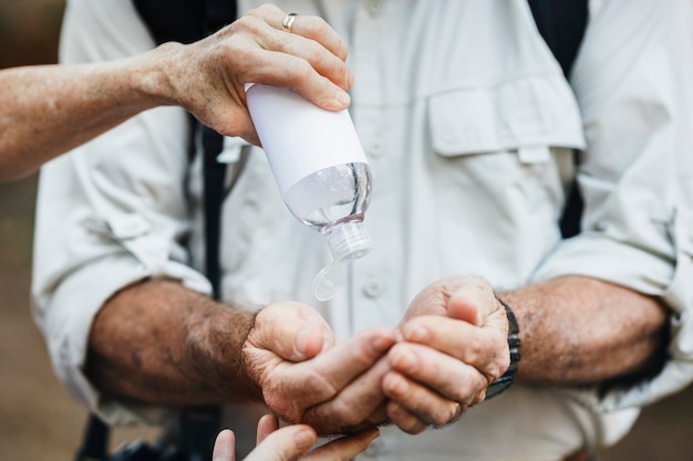 Free Photo using hand sanitizer while traveling in the new normal