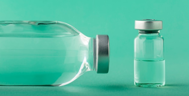 Vaccine bottle assortment on green