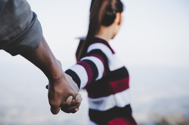 Free photo valentine couples walking hand in hand, promised to take care of each other with love