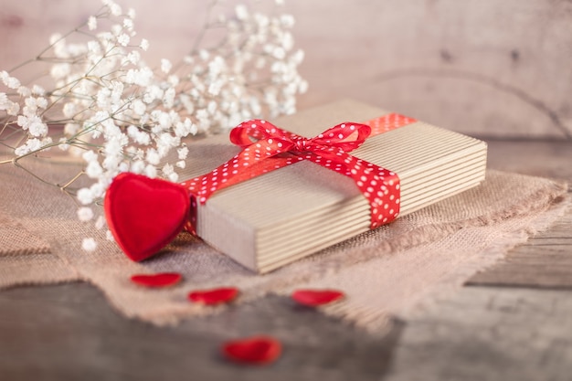 Valentine's gift and hearts on wood