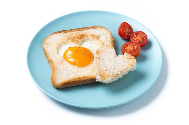 Free photo valentines day breakfast with egg with tomatoes heart shaped and toast bread isolated on white background