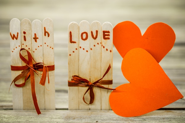 Free photo valentines day love inscription on small wooden sticks with a heart