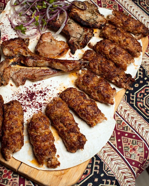 Variations of beef, lamp rack kebab, grill with hot bbq sauce and onion salad. 