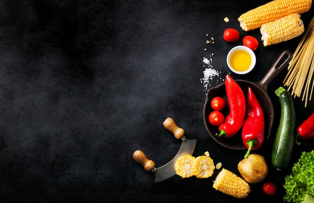 Free photo varied vegetables placed on a black table