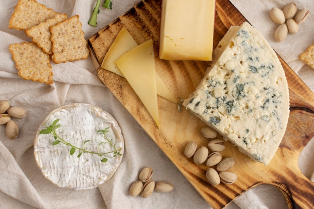 Variety cheeses and snacks on a table