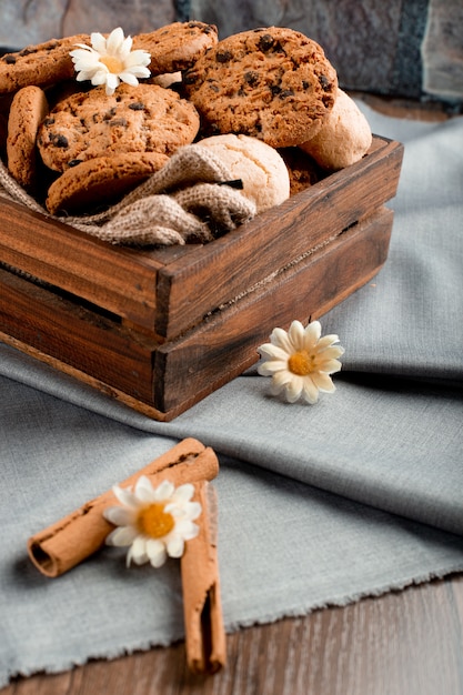 Free Photo variety of cookies in a wooden tray