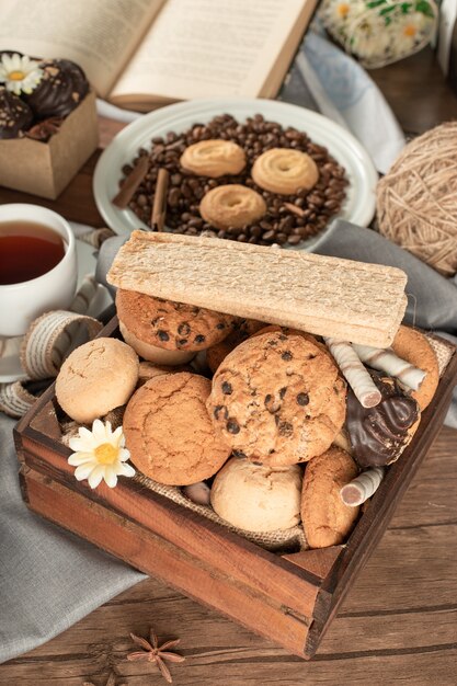 Variety of cookies in a wooden tray