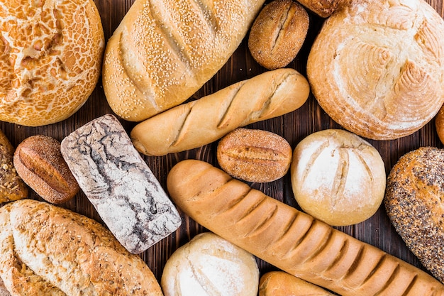 Free photo variety of freshly baked bread on table