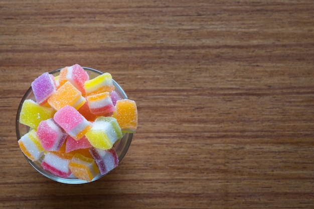 variety of gelly and candies on a wooden background