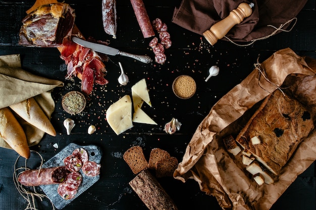  Variety meat delicacies: Sticks of smoked salami, cheese, spices, prosciutto 