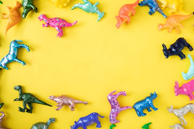 Free Photo various animal toy figures in a colorful background and a copyspace