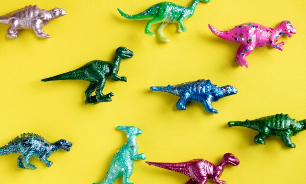 Various animal toy figures in a colorful background