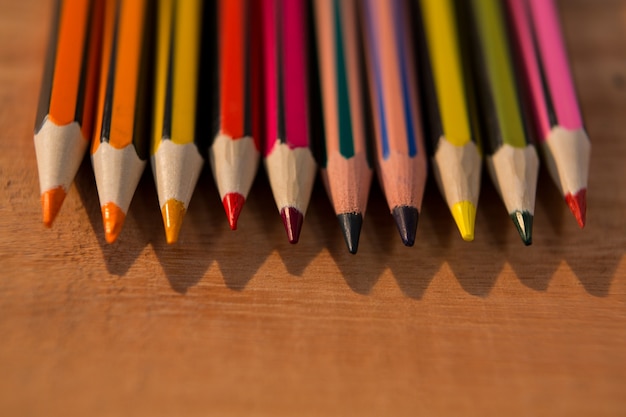 Free photo various color pencils on wooden table