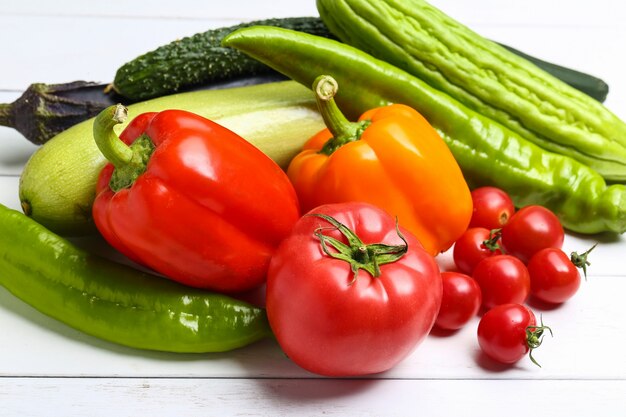 various colorful vegetables on white wooden table