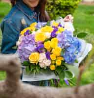 Free photo various flowers in girl hands