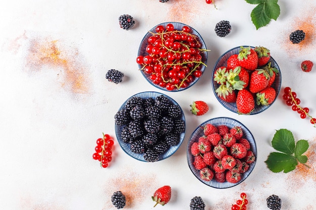 Free photo various fresh summer berries,blueberries,red currant,strawberries,blackberries,top view.