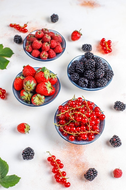 Free Photo various fresh summer berries,blueberries,red currant,strawberries,blackberries,top view.