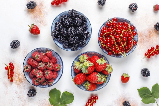 Free photo various fresh summer berries,blueberries,red currant,strawberries,blackberries,top view.