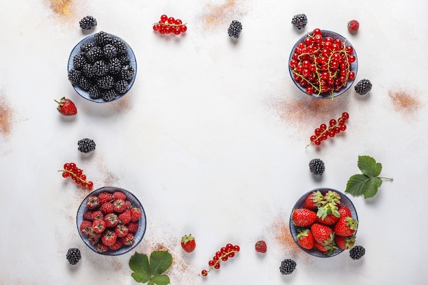 Free Photo various fresh summer berries,blueberries,red currant,strawberries,blackberries,top view.