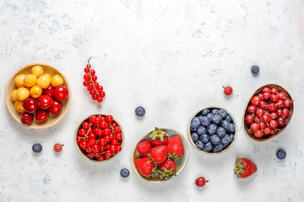 Various fresh summer berries, blueberries, red currant, top view.