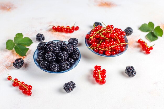 Various fresh summer berries, red currant, blackberries, top view.