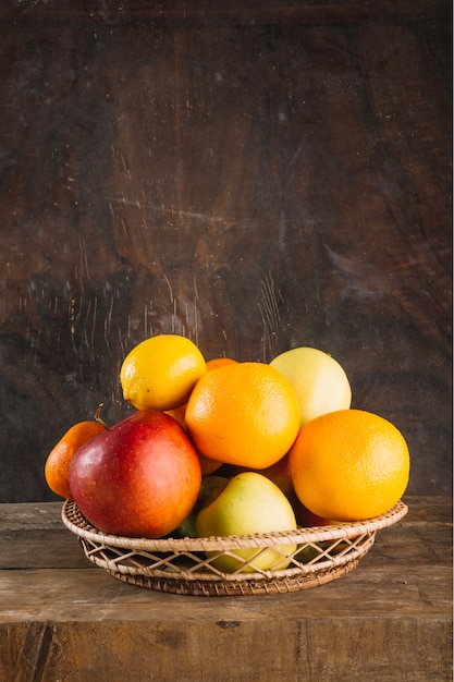 Various fruits in braided bowl