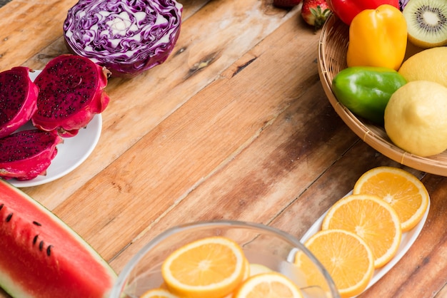 Various fruits with vegetable on wood background