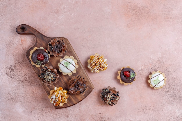 Various homemade mini tartlets with nuts and chocolate cream.