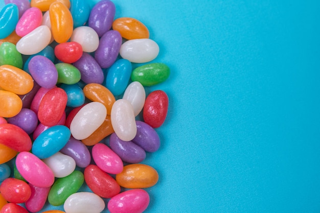 Various jelly beans on the blue background