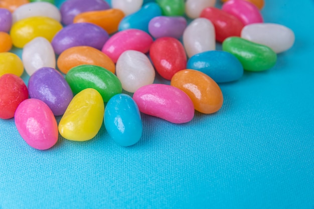 Various jelly beans on the blue background