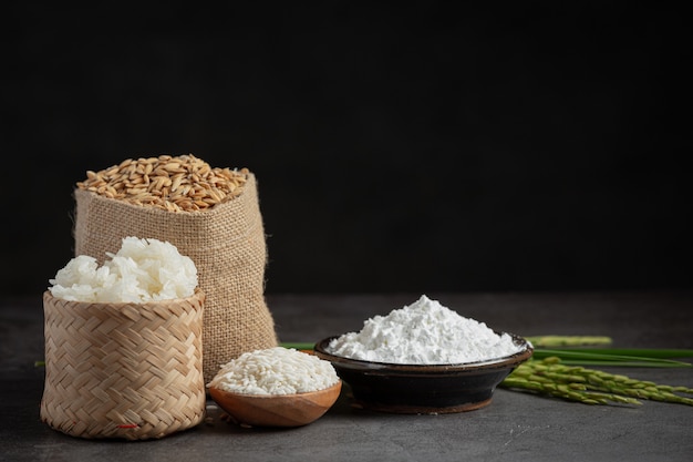 Various kinds of produce from rice on dark floor