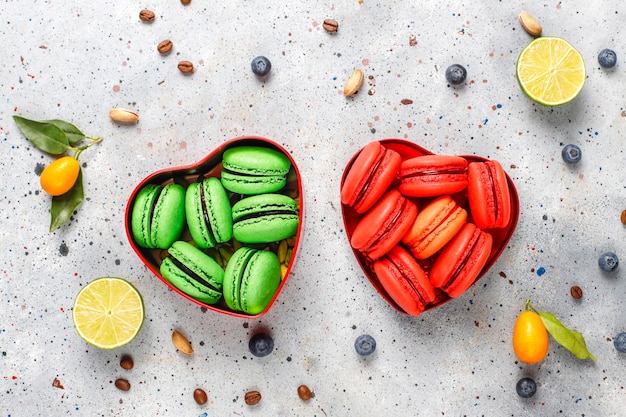 Free Photo various macaroons with pistachios, fruits, berries, coffee beans.