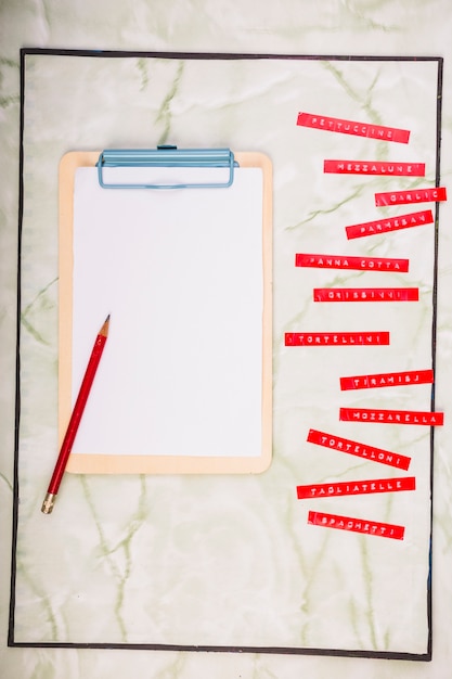 Various menus beside blank paper with clipboard